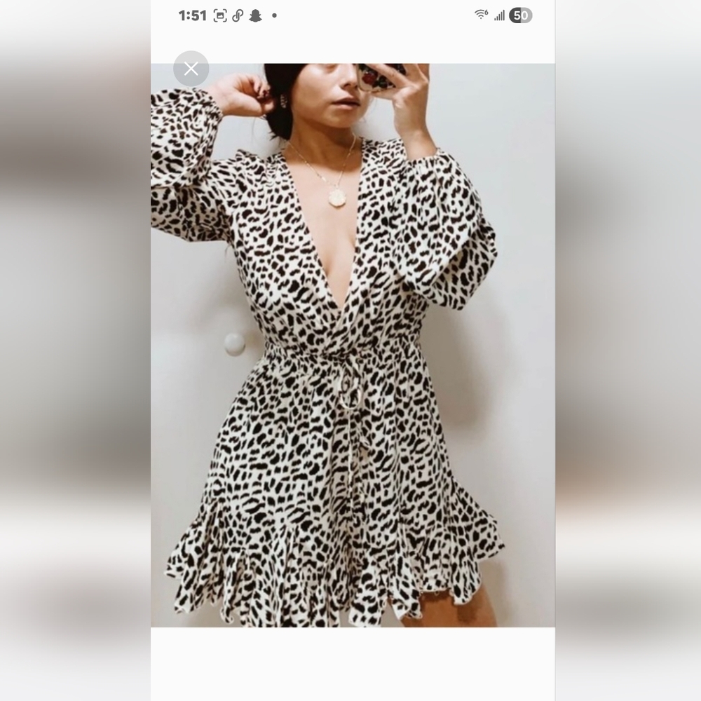 Luxxel White Leopard Print Long Sleeve Romper.